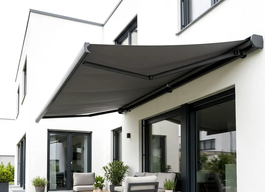 Folding-arm awning extended over a patio seating area at a Fourways home